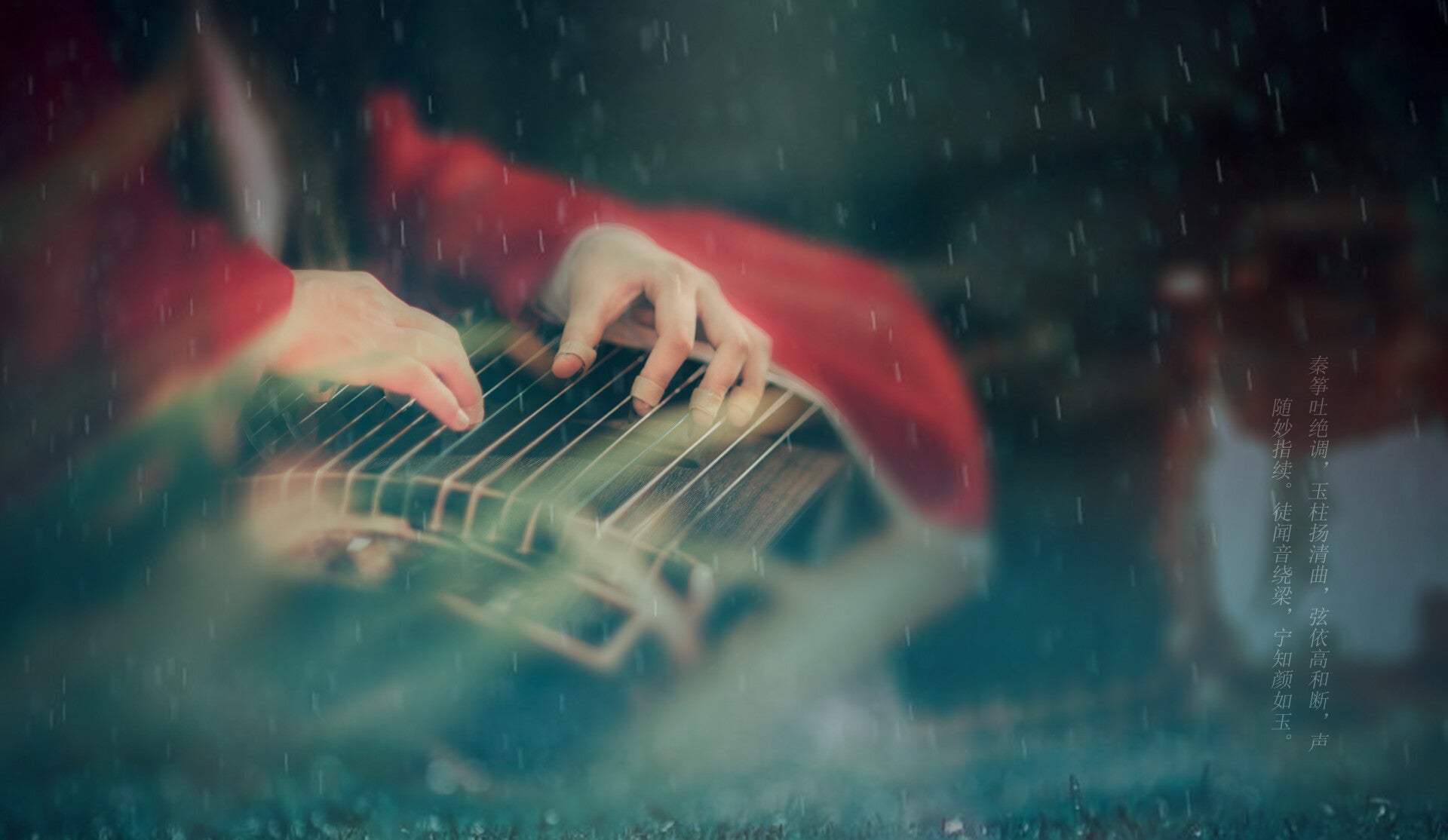 Hands performing on a traditional guzheng